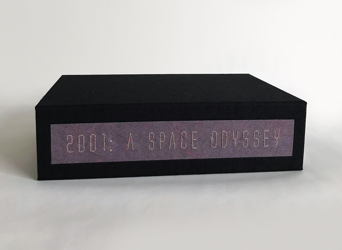 Close-up of box spine of 2001: A Space Odyssey binding on a white table.