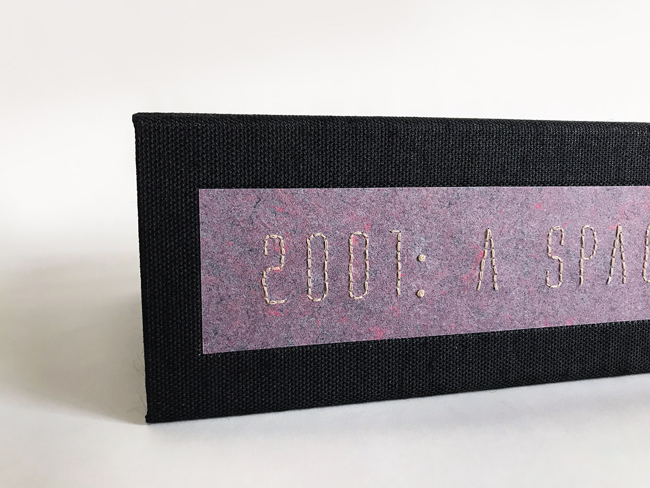 Close-up of box spine of 2001: A Space Odyssey binding on a white table.