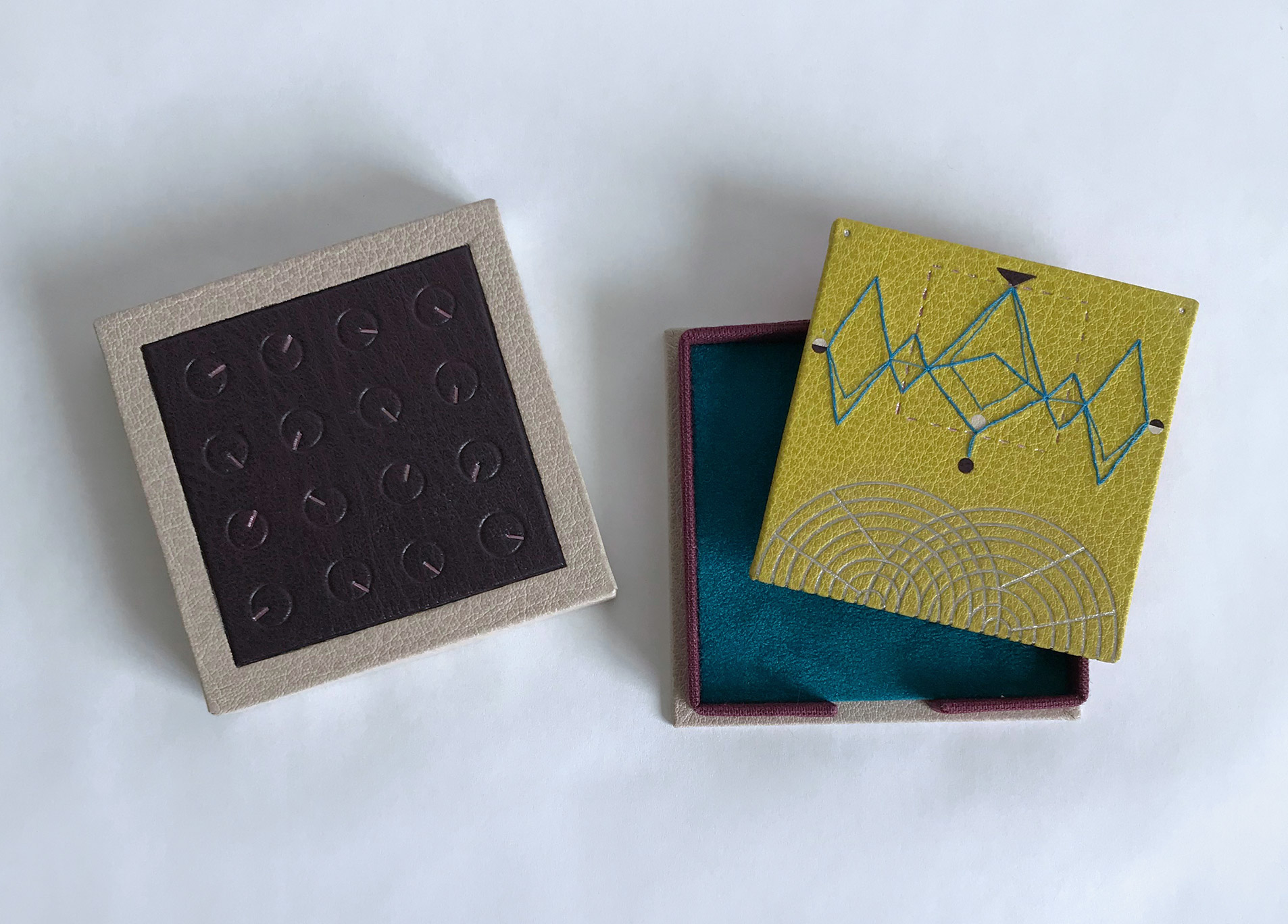 Music board and custom box interior on a white table.