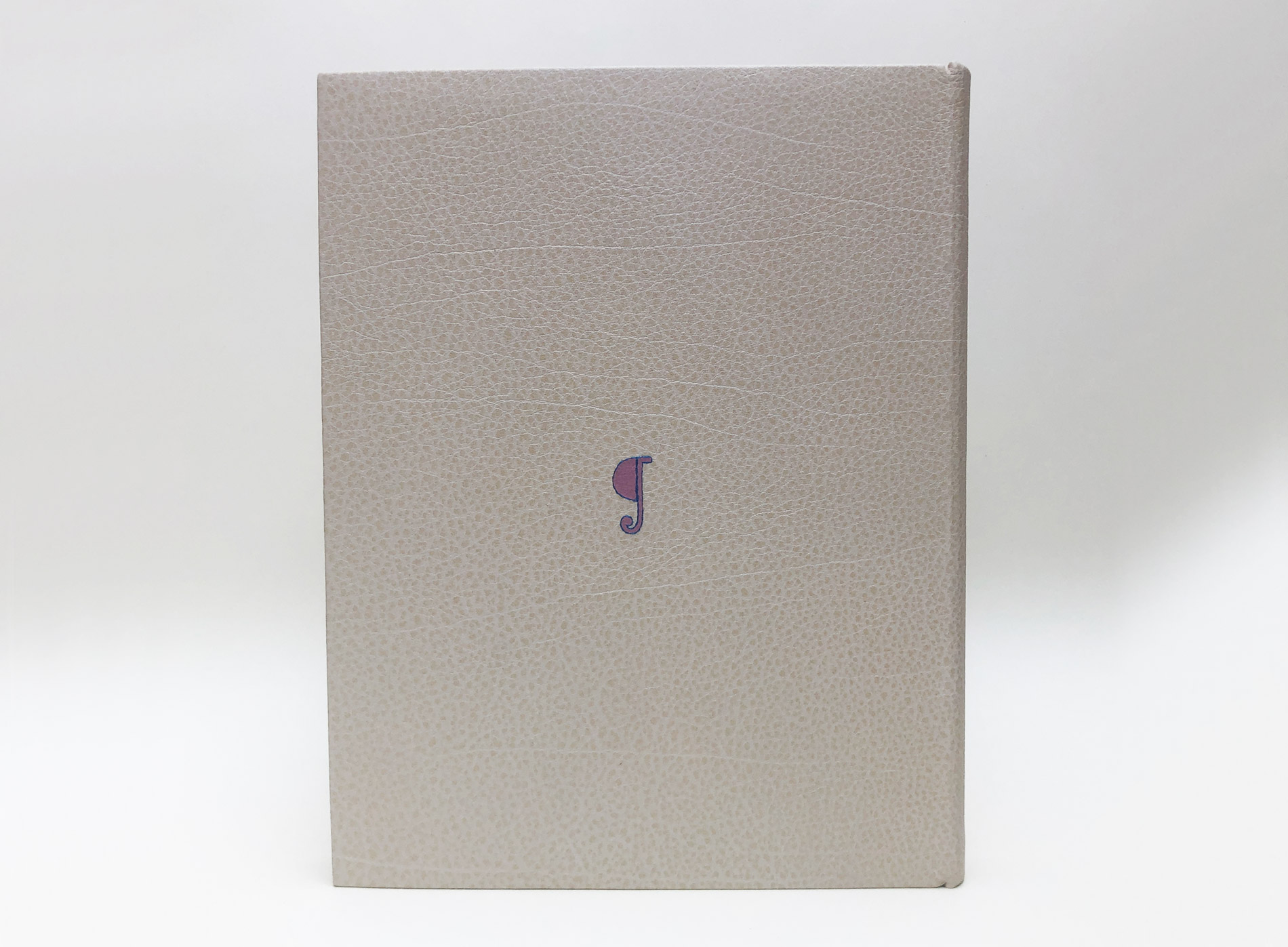 Back cover of One Hundred Books Famous in Typography binding on a white table.