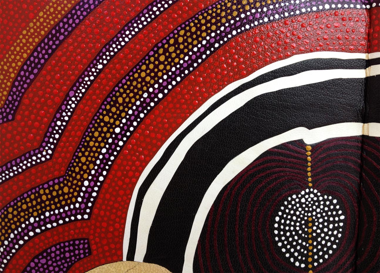 Close-up of front cover of The Songlines binding on a white table.