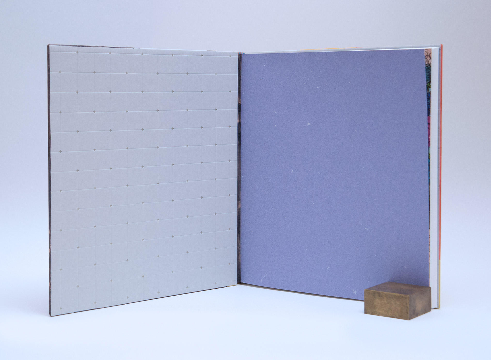 Interior of Stuart Williams binding on a white table.