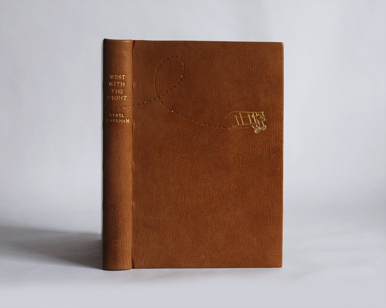 Front cover of West With the Night binding on a white table.