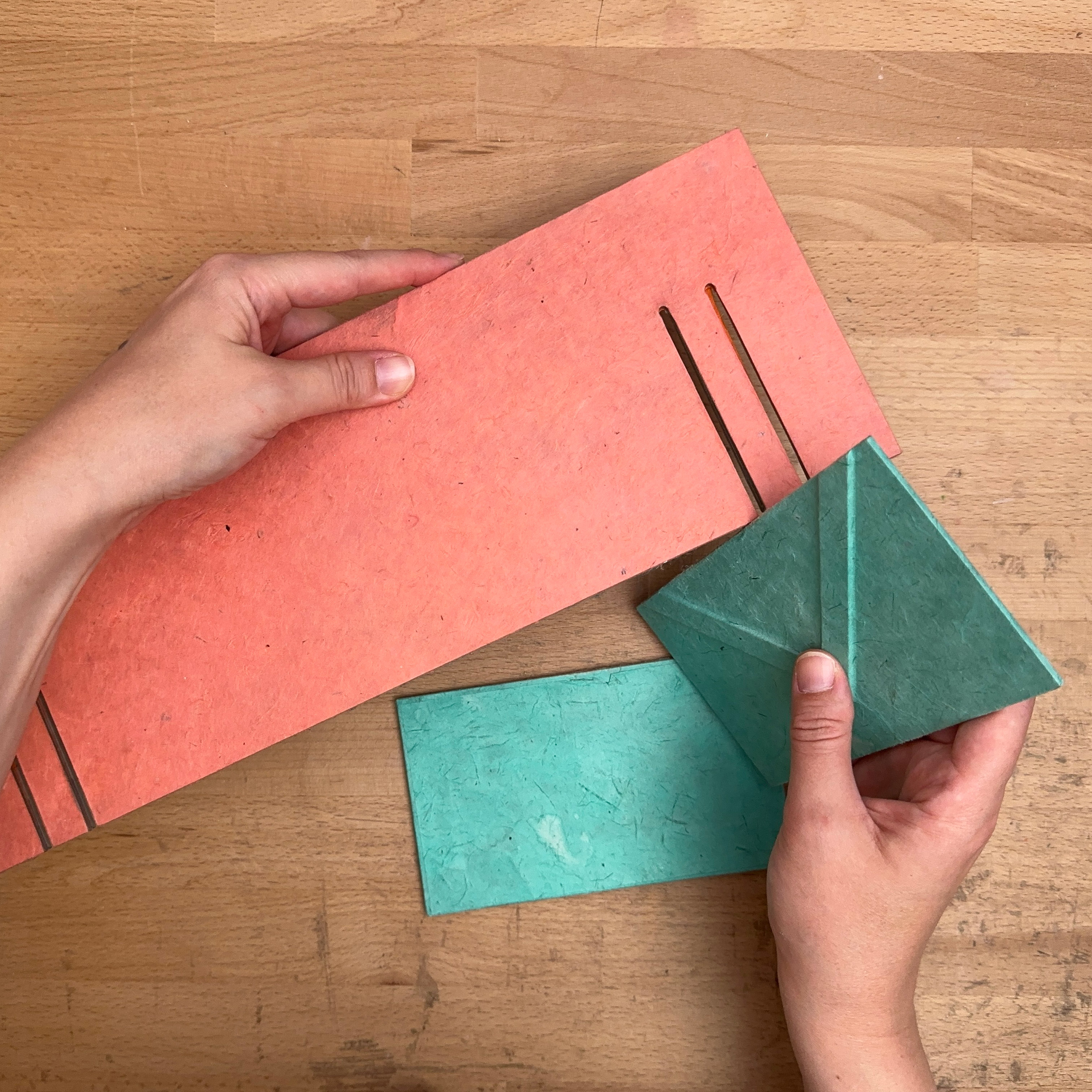 Artist demoing how to assemble the Collapsible Punching Cradle.